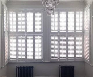 White sash window shutters